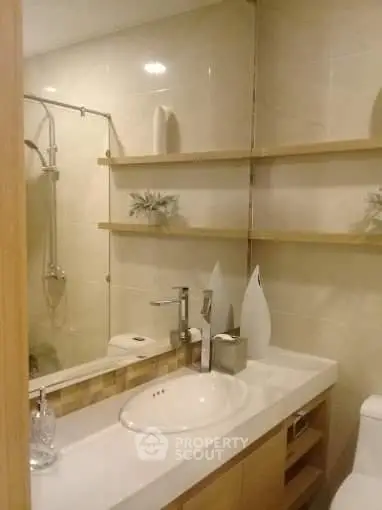 Modern bathroom with elegant fixtures and stylish shelving