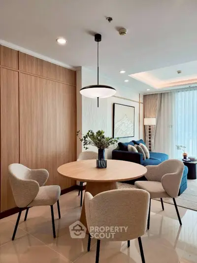 Modern living room with elegant dining area and stylish decor