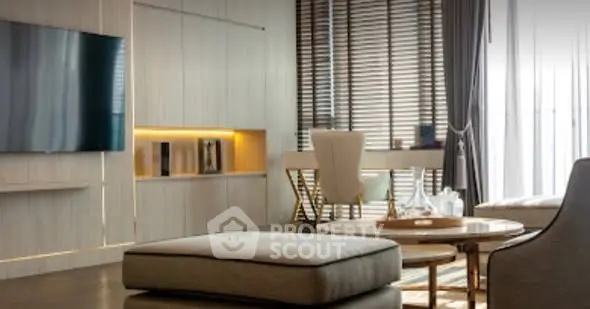 Modern living room with sleek furniture and large TV, perfect for stylish urban living.