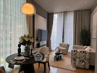 Luxurious modern living room with elegant decor and large windows offering city views.