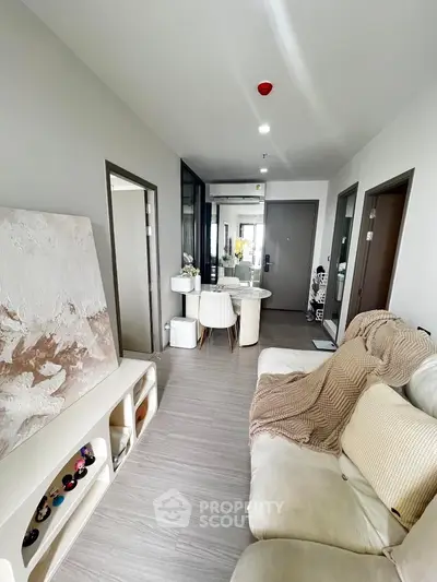 Modern living room with cozy sofa and elegant dining area in a stylish apartment