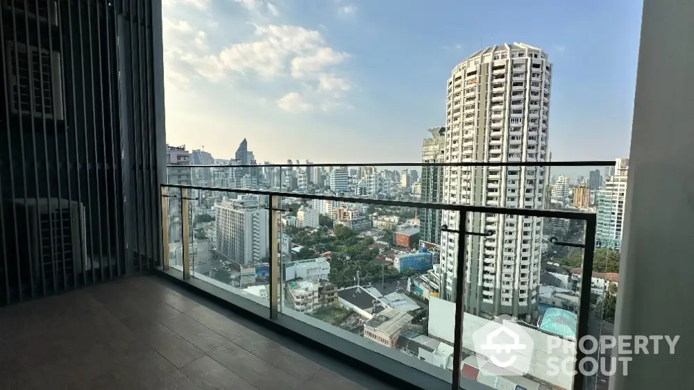 Stunning city view from modern balcony in high-rise apartment