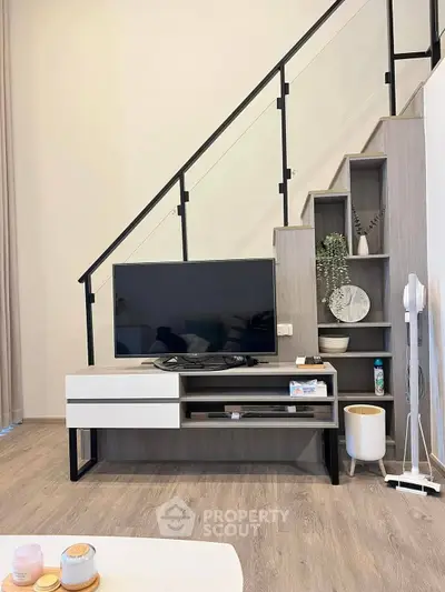 Modern living room with stylish TV stand and staircase storage