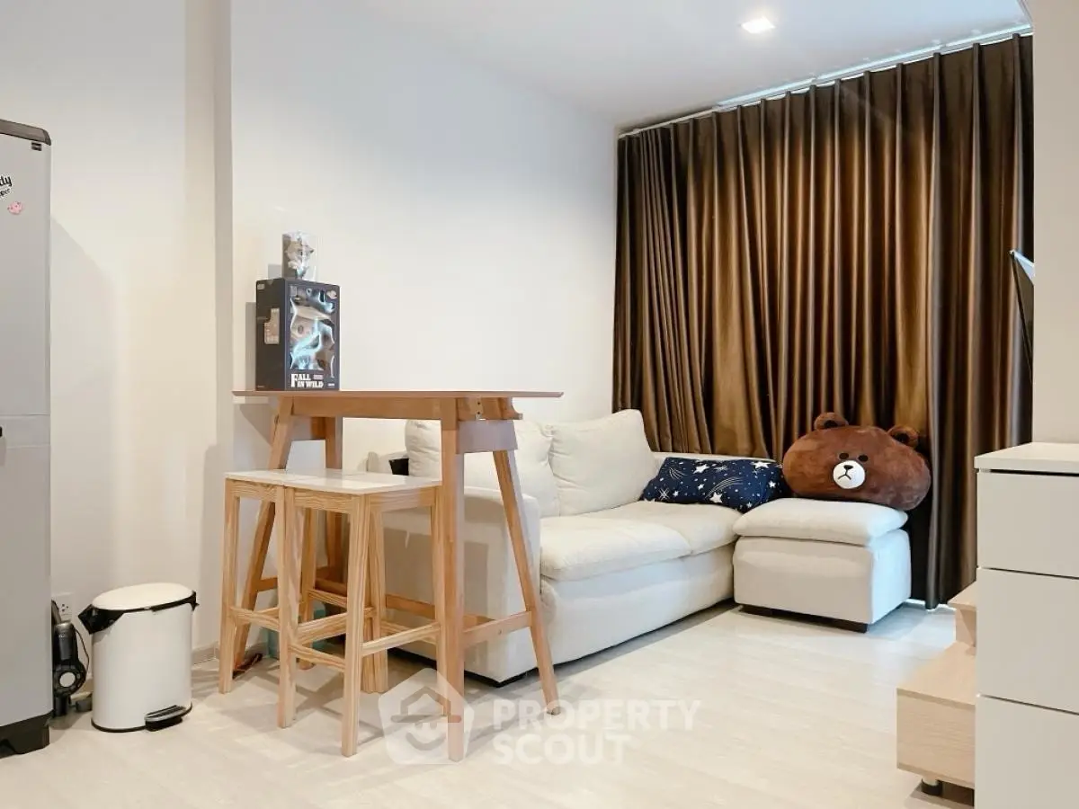 Cozy living room with modern decor and plush seating, perfect for relaxation and entertaining.