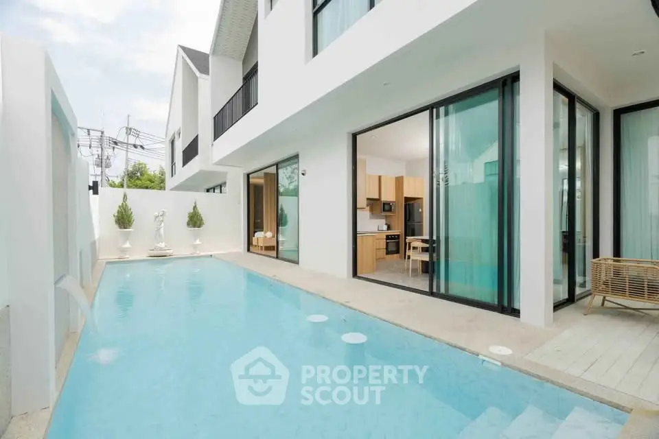 Luxurious modern villa with private pool and open kitchen layout, perfect for relaxation and entertaining.