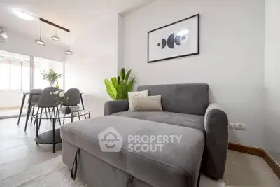 Modern living room with stylish gray sofa and elegant decor