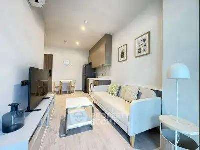 Modern living room with stylish decor and open kitchen layout