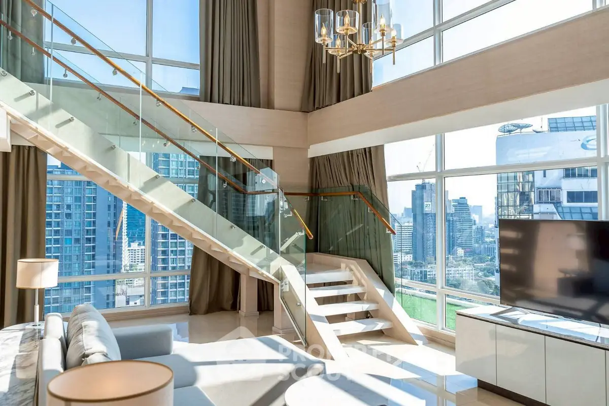 Luxurious modern living room with stunning city view and elegant staircase