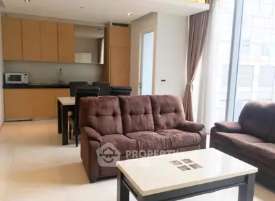 Spacious living room with modern kitchen and cozy seating area