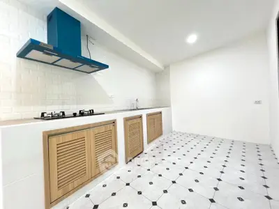 Modern kitchen with sleek design and gas stove in a spacious layout