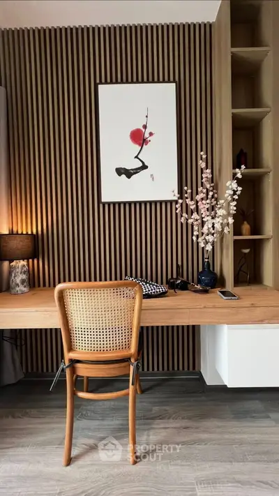 Stylish home office with wooden desk, elegant chair, and modern decor in a cozy setting.