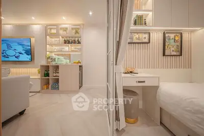 Modern living room with stylish decor and cozy bedroom nook