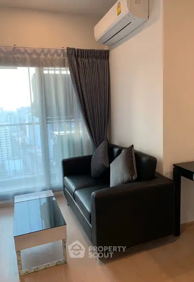 Cozy living room with modern sofa and city view balcony