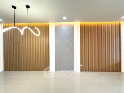 Modern interior with stylish lighting and textured wall panels