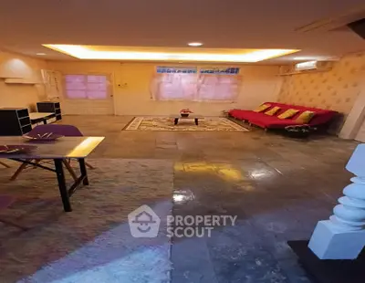 Spacious living room with modern decor and cozy seating area