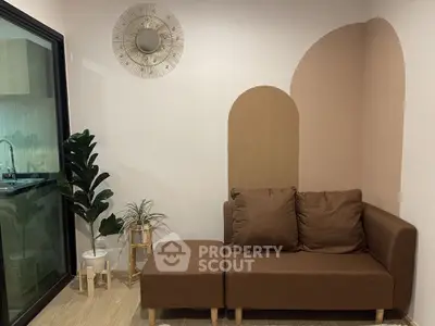 Cozy living room with modern brown sofa and stylish wall decor
