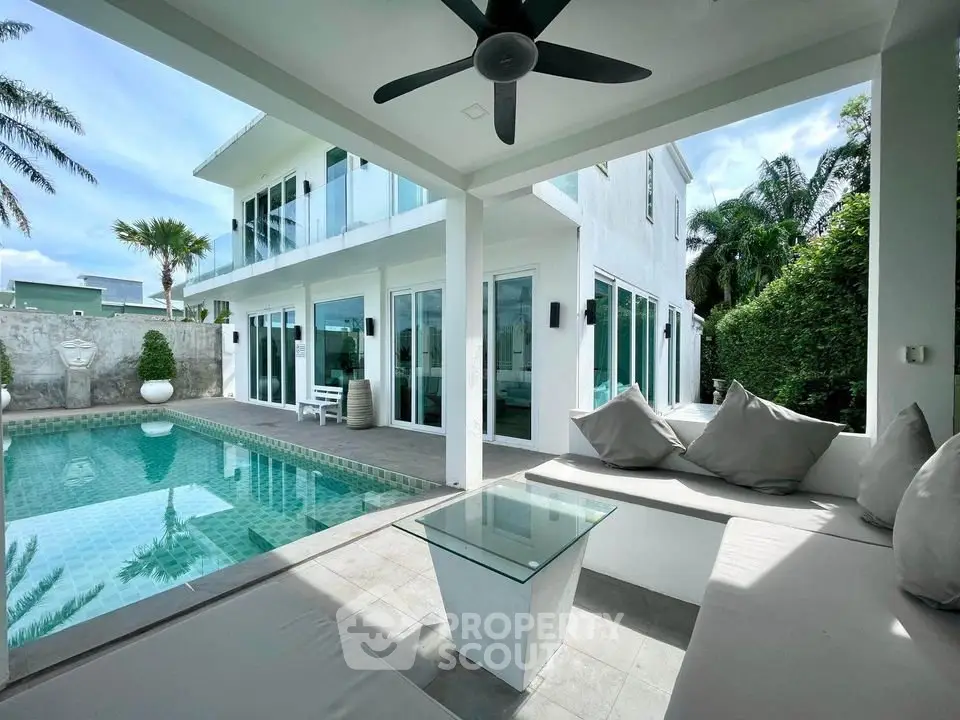 Luxurious modern villa with private pool and spacious outdoor seating area