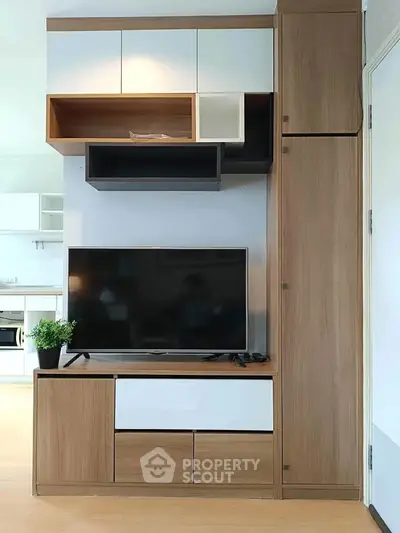 Modern living room with sleek TV unit and stylish cabinetry