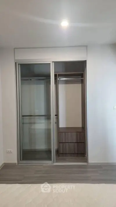 Modern bedroom with sleek built-in wardrobe and minimalist design