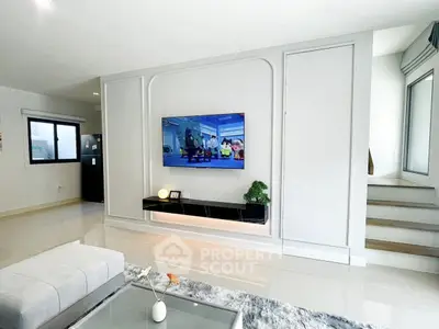 Modern living room with sleek TV setup and stylish decor