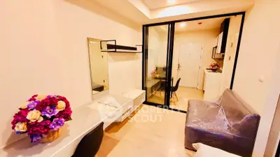 Modern studio apartment with sleek design and vibrant floral decor