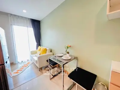 Modern living room with cozy seating and dining area, bright natural light, and stylish decor.