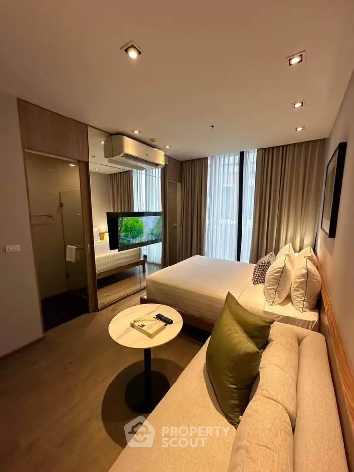 Modern studio apartment with cozy living area and stylish decor