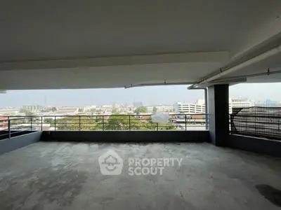 Spacious balcony with panoramic city views, perfect for relaxation and entertainment.