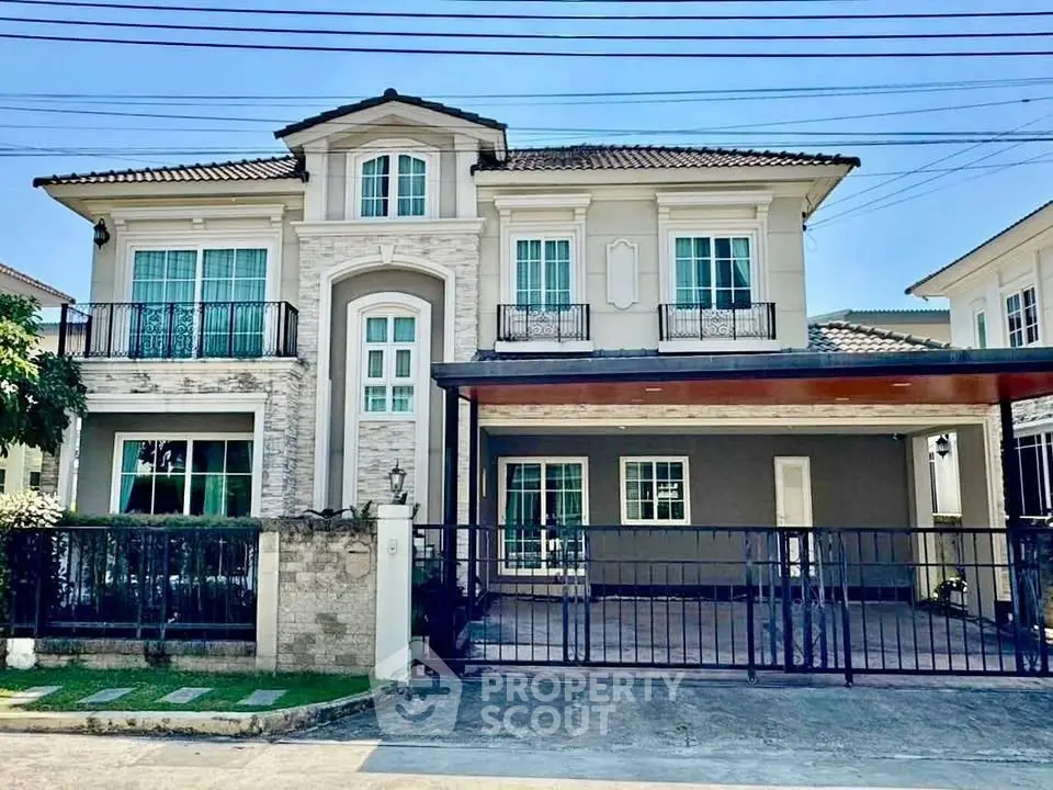 Elegant two-story house with modern facade and spacious driveway in a serene neighborhood.