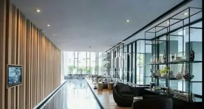 Luxurious modern lobby with sleek design and elegant decor in upscale building.