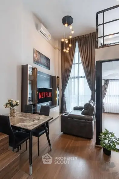 Modern loft-style living room with high ceilings and elegant decor