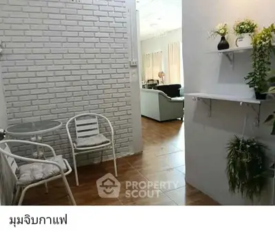 Charming interior with cozy seating area and stylish decor, perfect for relaxation.