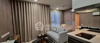 Modern studio apartment with cozy living area and stylish kitchen