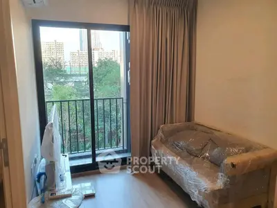 Cozy living room with balcony view in modern apartment