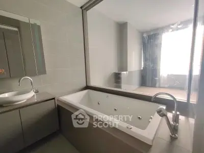 Modern bathroom with sleek bathtub and stylish fixtures