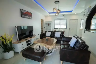 Stylish modern living room with leather sofas, unique wooden coffee table, and ambient lighting.