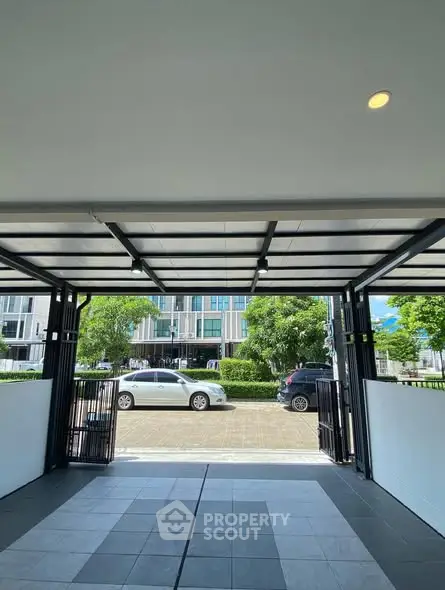 Modern residential garage with open door and street view
