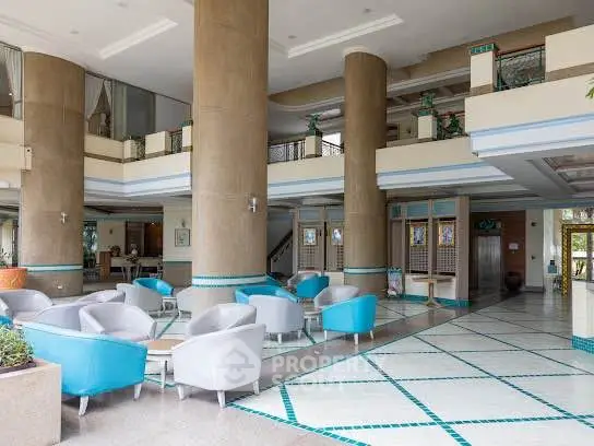 Luxurious hotel lobby with modern seating and elegant columns
