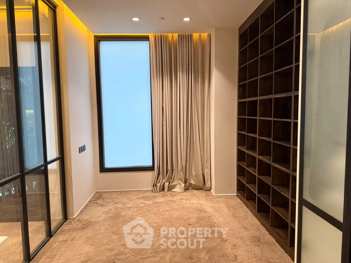 Luxurious study room with plush carpet and floor-to-ceiling window