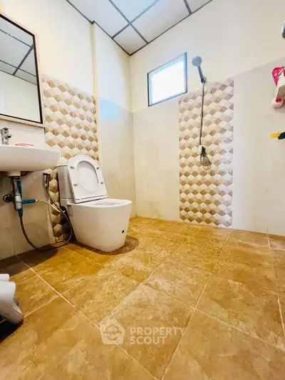 Spacious bathroom with modern fixtures and stylish tile design