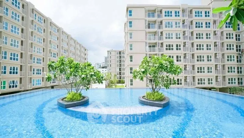 Luxurious apartment complex with stunning pool and modern architecture