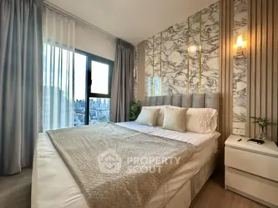 Luxurious bedroom with city view, elegant decor, and plush bedding in modern apartment.