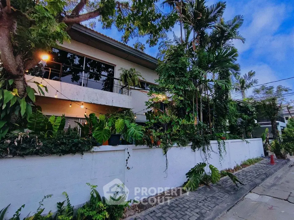 Charming modern house with lush greenery and spacious balcony in serene neighborhood