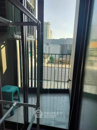 Cozy balcony with city view, perfect for relaxation and enjoying the skyline.