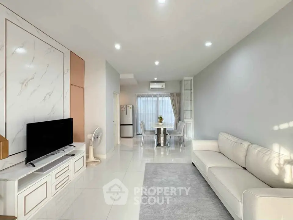 Spacious modern living room with elegant decor and natural light