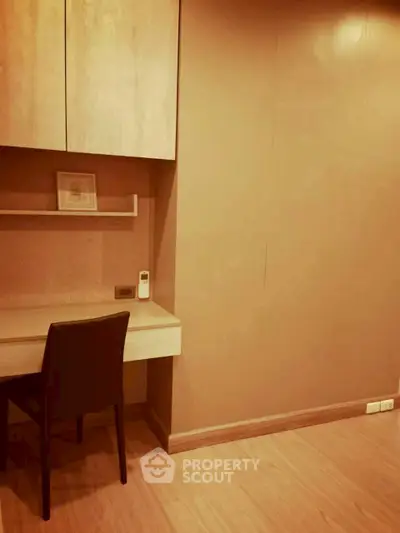 Modern study area with sleek desk and chair in a cozy apartment