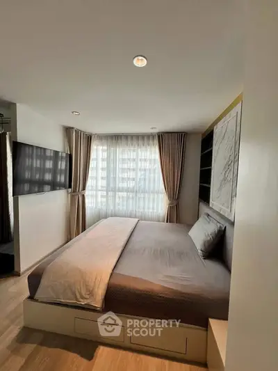Modern bedroom with large window and stylish decor