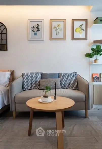 Charming living room with cozy sofa, stylish decor, and inviting ambiance.