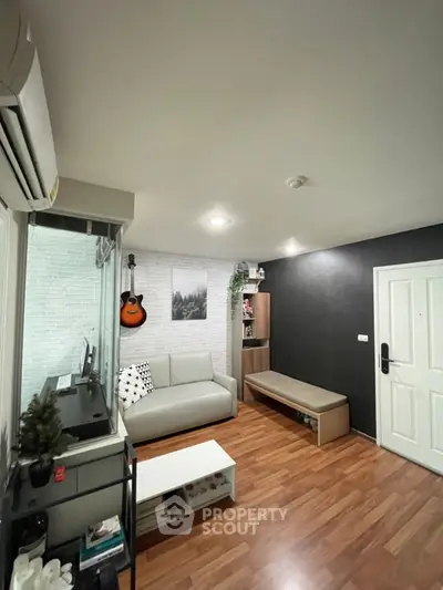 Modern living room with stylish decor and wooden flooring