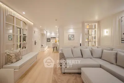 Luxurious open-plan living room with elegant decor and spacious seating area